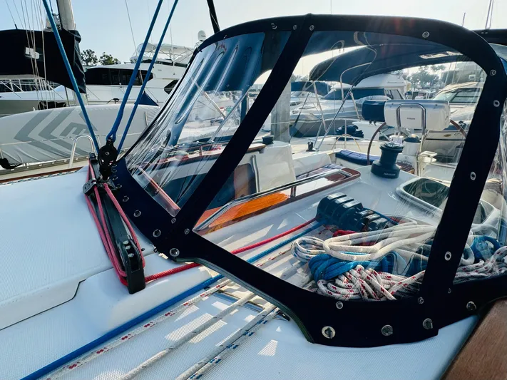 La Dauphine Yacht Photos Pics 2007 Jeanneau Sun Odyssey 36i sailboat cockpit with ropes and clear canopy.