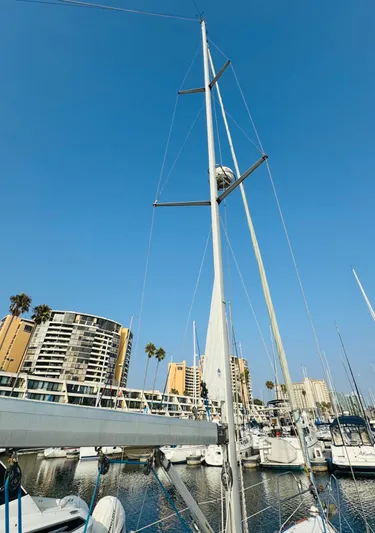 La Dauphine Yacht Photos Pics 2007 Jeanneau Sun Odyssey 36i sailboat docked in marina, clear blue sky.