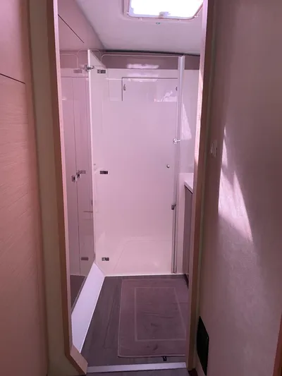 Anth'r'flo Yacht Photos Pics Interior of 2017 Fountaine Pajot Helia catamaran, featuring a modern bathroom with glass shower.