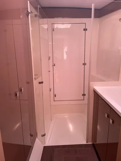 Anth'r'flo Yacht Photos Pics Bathroom interior of 2017 Fountaine Pajot Helia catamaran, featuring modern shower and cabinetry.