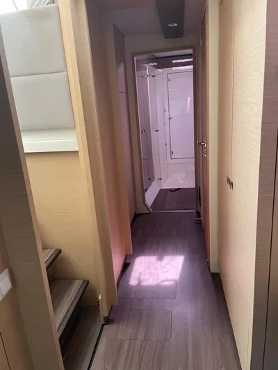 Anth'r'flo Yacht Photos Pics Interior hallway of 2017 Fountaine Pajot Helia catamaran, featuring modern wood finishes.