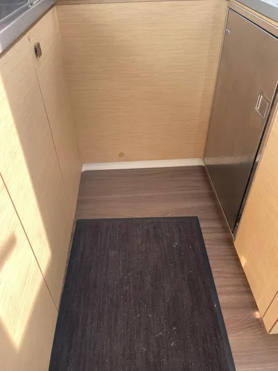 Anth'r'flo Yacht Photos Pics 2017 Fountaine Pajot Helia kitchen area with wood cabinets and flooring.