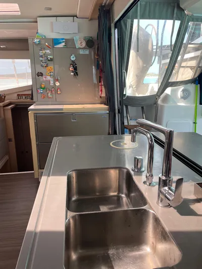 Anth'r'flo Yacht Photos Pics Modern kitchen interior of 2017 Fountaine Pajot Helia catamaran with stainless steel sink.