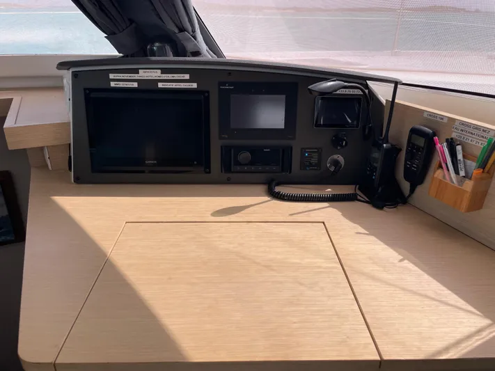 Anth'r'flo Yacht Photos Pics Navigation station of 2017 Fountaine Pajot Helia catamaran with control panels and communication devices.