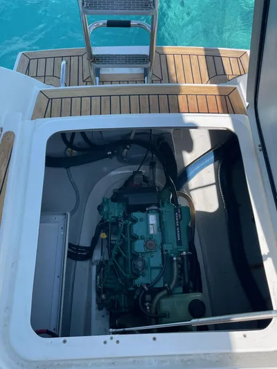 Anth'r'flo Yacht Photos Pics Engine compartment of 2017 Fountaine Pajot Helia catamaran with open hatch, showing marine engine.