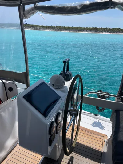 Anth'r'flo Yacht Photos Pics 2017 Fountaine Pajot Helia catamaran helm with ocean view and distant shoreline.