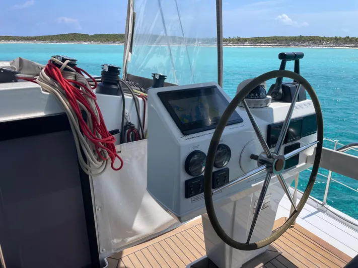 Anth'r'flo Yacht Photos Pics Helm of 2017 Fountaine Pajot Helia catamaran with ocean view and navigation equipment.