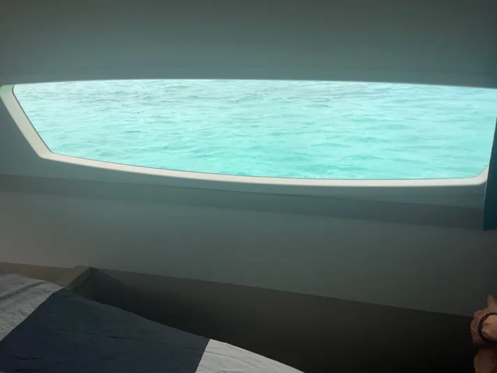 Anth'r'flo Yacht Photos Pics Cabin view from 2017 Fountaine Pajot Helia, overlooking serene turquoise waters.