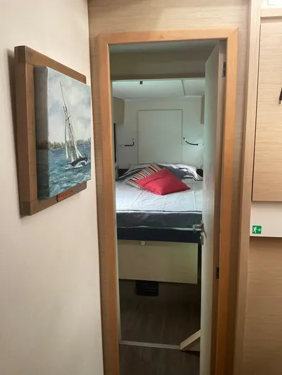 Anth'r'flo Yacht Photos Pics Interior cabin of 2017 Fountaine Pajot Helia catamaran with bed and nautical decor.