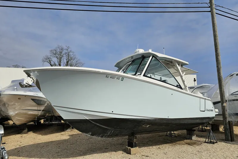  Yacht Photos Pics 2023 Sailfish 316 DC boat displayed outdoors on a stand.