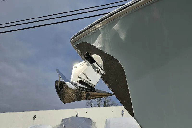 Yacht Photos Pics 2023 Sailfish 316 DC boat anchor detail against cloudy sky.