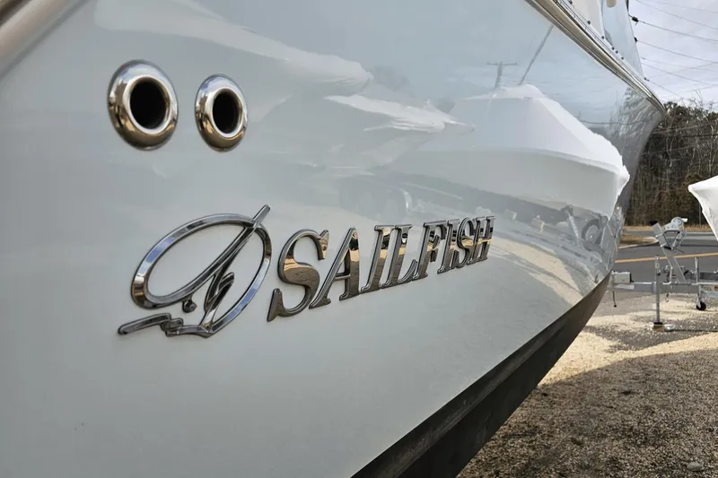 Yacht Photos Pics 2023 Sailfish 316 DC boat with logo and chrome details.
