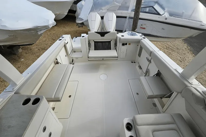  Yacht Photos Pics 2023 Sailfish 316 DC boat interior with spacious seating and storage compartments.