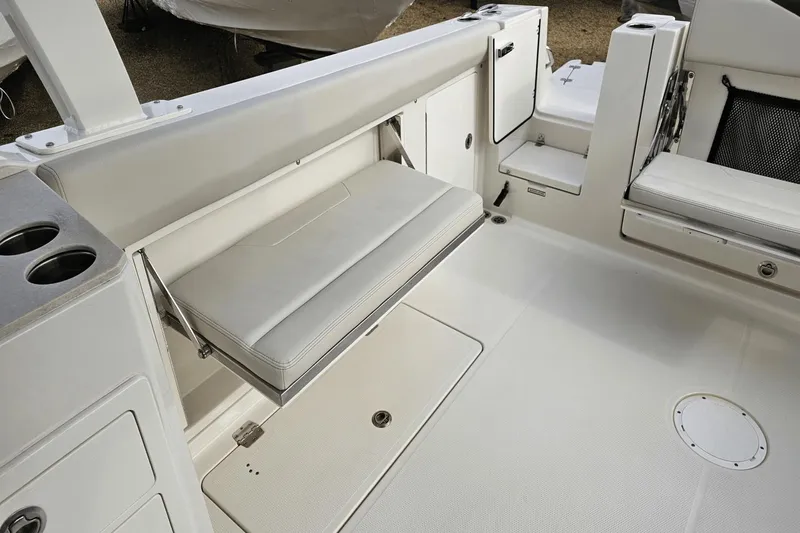  Yacht Photos Pics 2023 Sailfish 316 DC boat interior with foldable seating and cup holders.