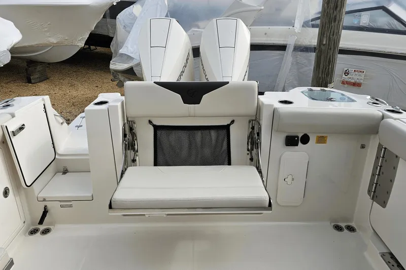  Yacht Photos Pics 2023 Sailfish 316 DC boat interior with seating and storage compartments.