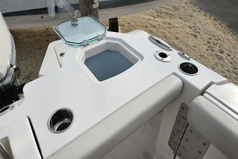  Yacht Photos Pics 2023 Sailfish 316 DC boat interior with cup holders and storage compartment.
