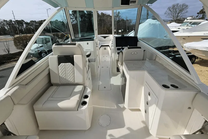  Yacht Photos Pics 2023 Sailfish 316 DC boat interior with modern seating and control panel.