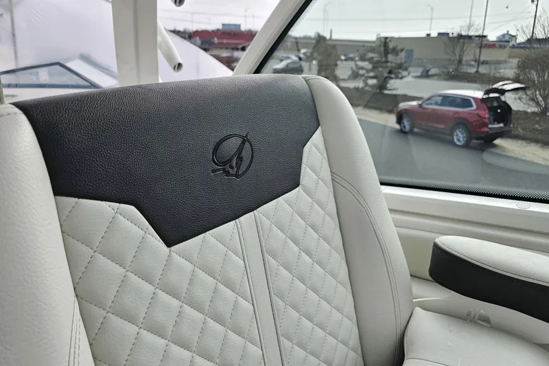  Yacht Photos Pics Luxurious interior of 2023 Sailfish 316 DC boat with quilted leather seating.