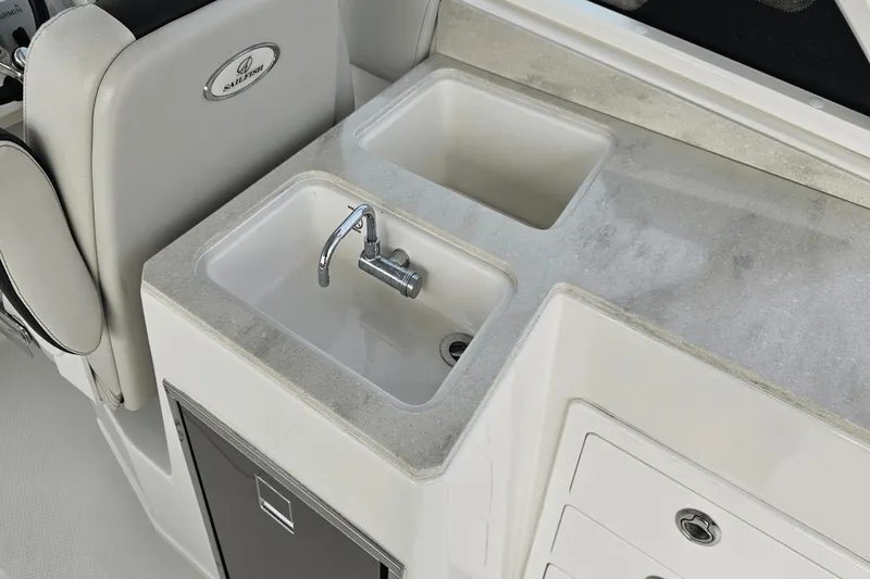  Yacht Photos Pics 2023 Sailfish 316 DC boat interior with sink and storage compartments.