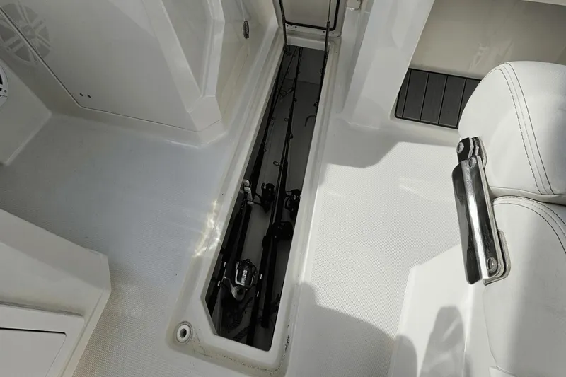  Yacht Photos Pics 2023 Sailfish 316 DC boat interior with rod storage compartment.
