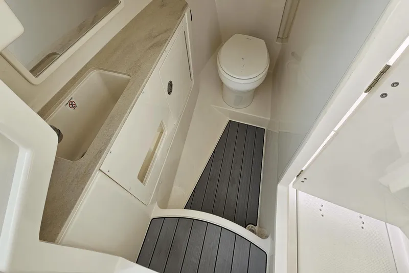  Yacht Photos Pics 2023 Sailfish 316 DC boat bathroom with sink, toilet, and modern design.