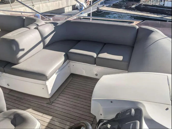  Yacht Photos Pics Luxurious seating on 2014 Princess 52 Flybridge yacht with sleek gray cushions.