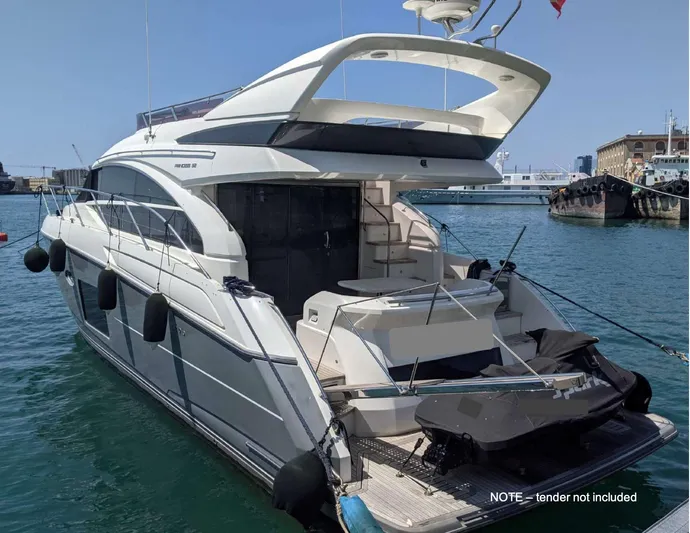  Yacht Photos Pics 2014 Princess 52 Flybridge yacht docked at marina, rear view.