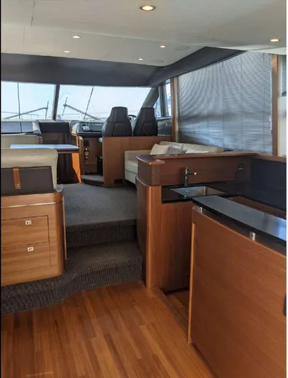  Yacht Photos Pics Luxurious interior of 2014 Princess 52 Flybridge yacht with modern wood finishes.