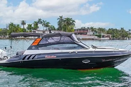  Yacht Photos Pics 2024 Hanover 305 Sport Edition boat on water, sleek design, tropical backdrop.