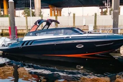  Yacht Photos Pics 2024 Hanover 305 Sport Edition boat docked, sleek design with black and orange accents.