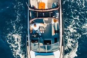  Yacht Photos Pics 2024 Hanover 305 Sport Edition boat cruising on open water, aerial view.