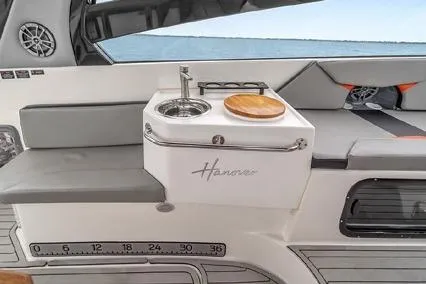  Yacht Photos Pics 2024 Hanover 305 Sport Edition boat interior with sink and seating area.