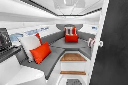  Yacht Photos Pics 2024 Hanover 305 Sport Edition interior with modern seating and vibrant cushions.