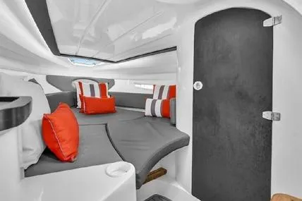  Yacht Photos Pics 2024 Hanover 305 Sport Edition cabin with modern seating and vibrant cushions.