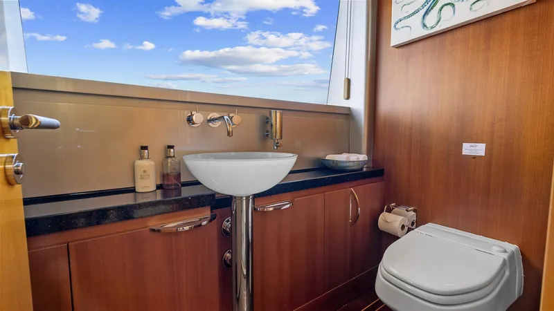 My Spirit Yacht Photos Pics Luxurious yacht bathroom with modern fixtures, wooden cabinetry, and ocean view. New Zealand Yachts Wave Piercer 2005.