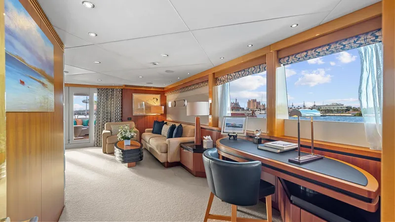 My Spirit Yacht Photos Pics Luxurious interior of 2005 New Zealand Yachts Wave Piercer, featuring elegant seating and workspace.