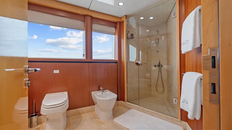 My Spirit Yacht Photos Pics Luxurious bathroom on 2005 New Zealand Yachts Wave Piercer, featuring glass shower and ocean view.