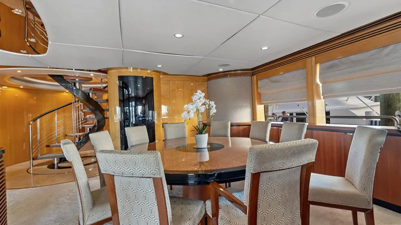 My Spirit Yacht Photos Pics Luxurious dining area on 2005 New Zealand Yachts Wave Piercer with elegant decor and spiral staircase.