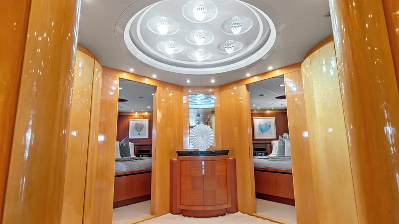 My Spirit Yacht Photos Pics Luxurious interior of 2005 New Zealand Yachts Wave Piercer with elegant wood paneling and modern lighting.