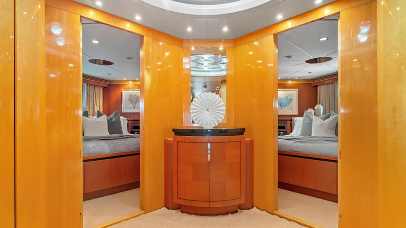 My Spirit Yacht Photos Pics Luxurious interior of 2005 New Zealand Yachts Wave Piercer with elegant wood paneling and modern decor.