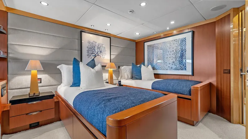 My Spirit Yacht Photos Pics Luxurious 2005 New Zealand Yachts Wave Piercer cabin with twin beds and elegant decor.