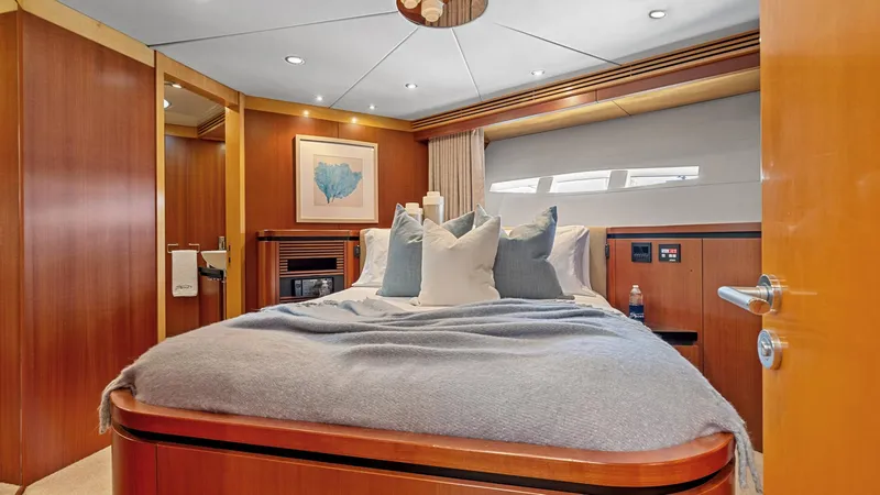My Spirit Yacht Photos Pics Luxurious bedroom interior of 2005 New Zealand Yachts Wave Piercer with elegant wood finish.