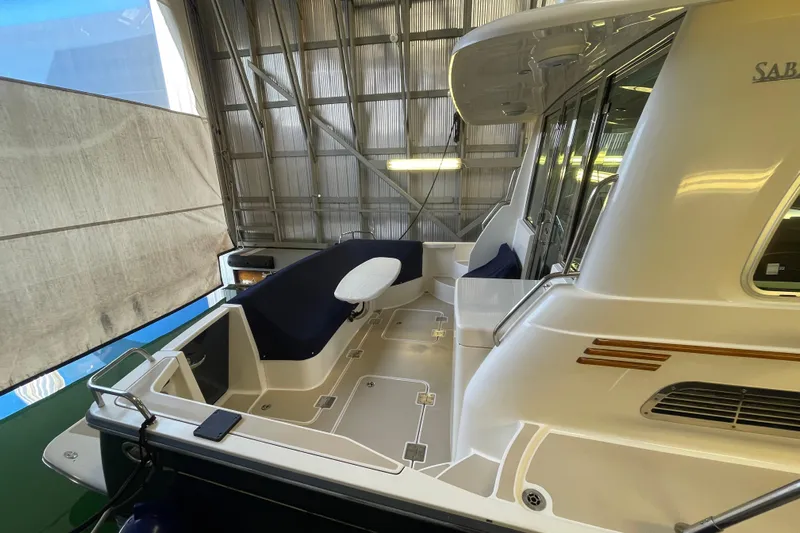  Yacht Photos Pics 2014 Sabre 42 Salon Express yacht interior with seating and sleek design.