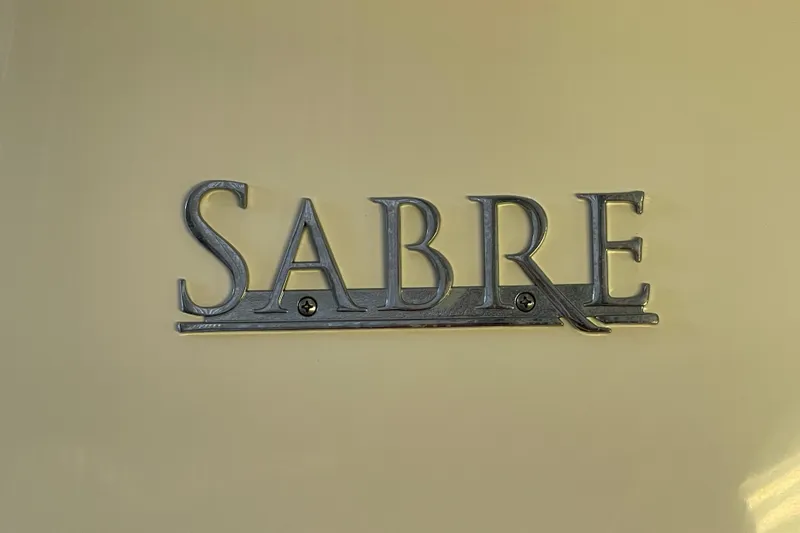  Yacht Photos Pics Sabre 42 Salon Express 2014 emblem on a beige background.