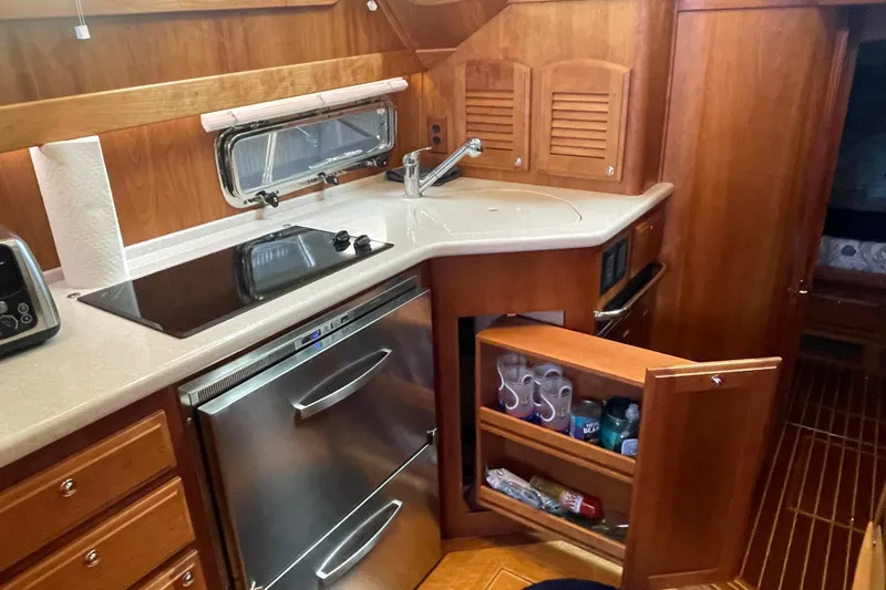  Yacht Photos Pics 2014 Sabre 42 Salon Express galley with stove, sink, and storage cabinets.