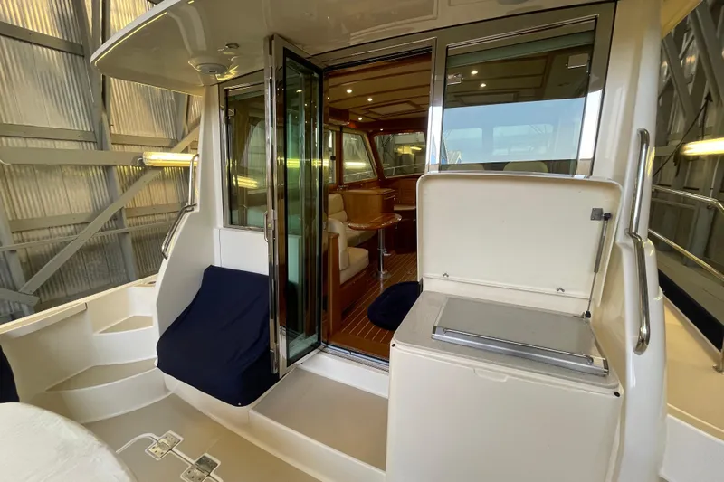  Yacht Photos Pics 2014 Sabre 42 Salon Express yacht interior with open sliding doors and seating area.