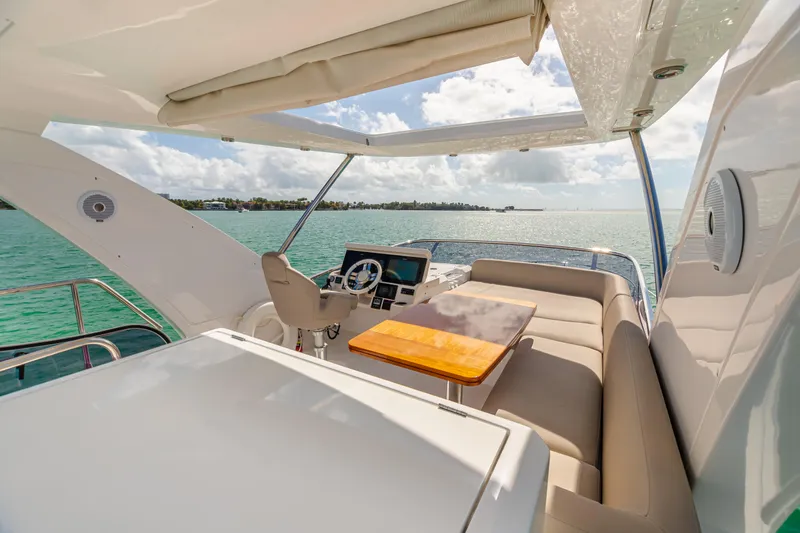 Blessed Yacht Photos Pics 2020 Azimut AZ 50-Fly yacht flybridge with seating, table, and ocean view.