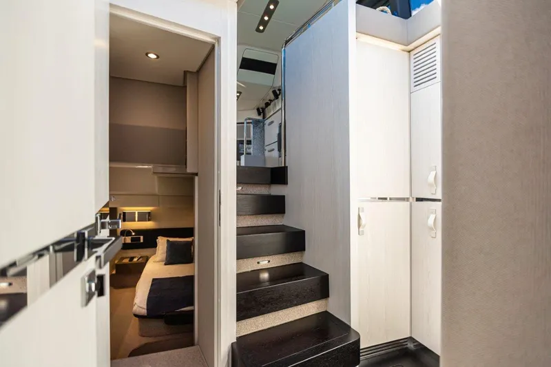 Blessed Yacht Photos Pics Interior of 2020 Azimut AZ 50-Fly yacht featuring modern staircase and cozy cabin.