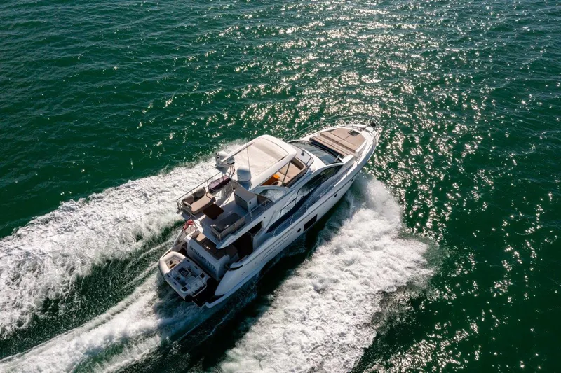 Blessed Yacht Photos Pics 2020 Azimut AZ 50-Fly yacht cruising on open water, aerial view.