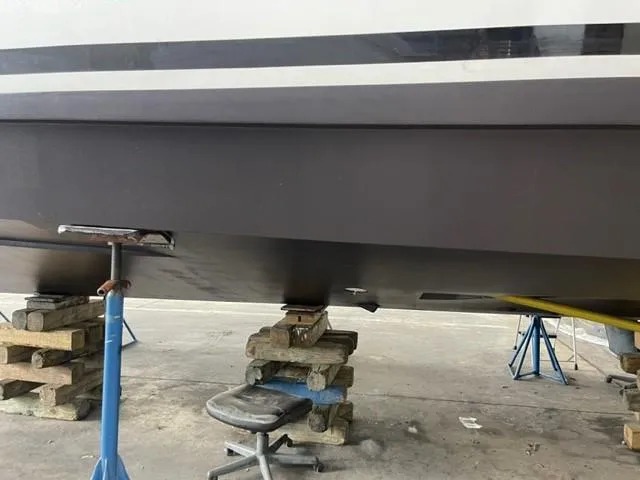 Blessed Yacht Photos Pics 2020 Azimut AZ 50-Fly yacht hull on supports in a maintenance area.